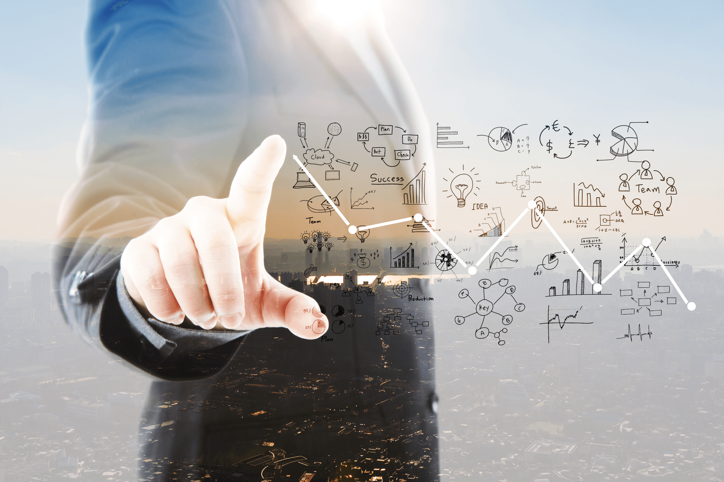 Businessman pointing graphs symbols