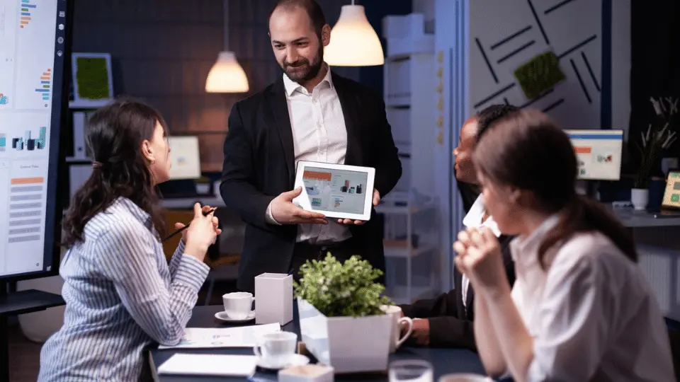 International-offering-unleash man showing sth on a tablet